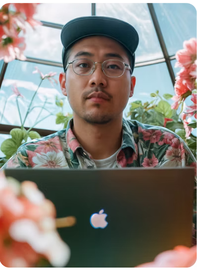 An embedded AI specialist working from a quiet, plant-filled space.